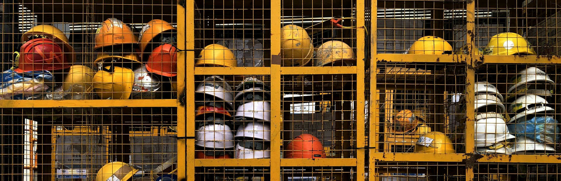 Site supervisor in safety helmet and high-visibility vest