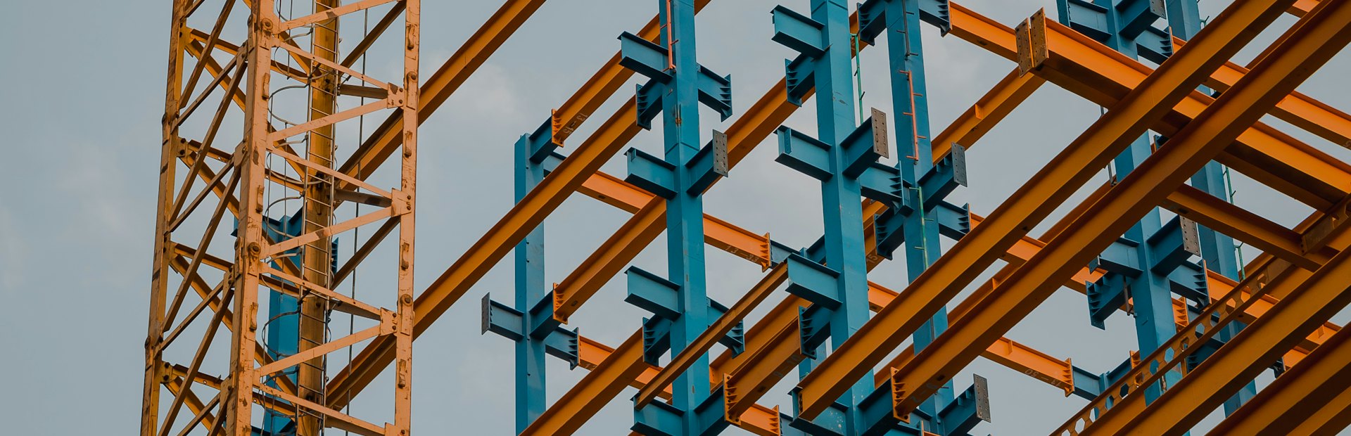Structural steelwork against a clear sky