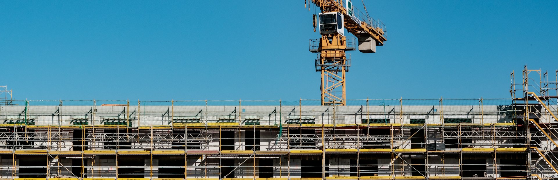 Tower crane above a building under construction